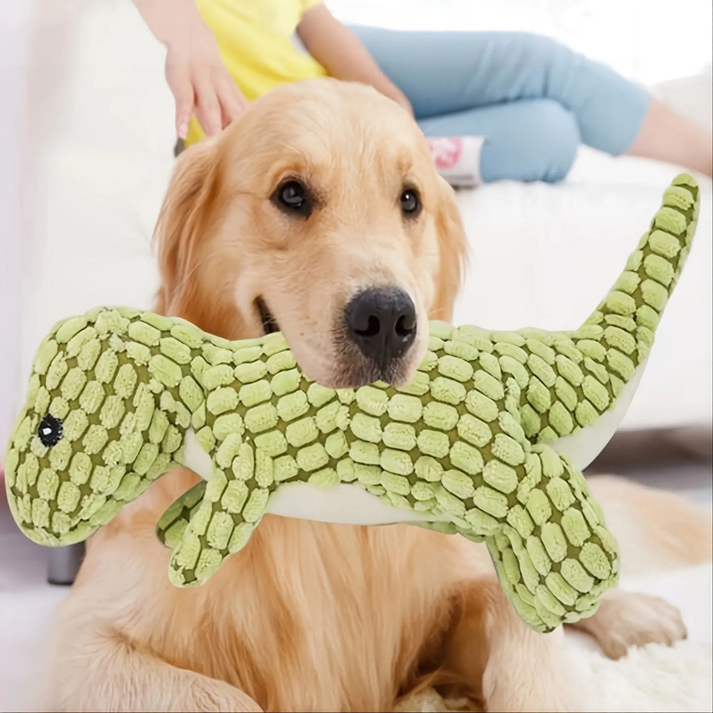 Set of four grey, green, and orange dog toys with sound features for chewing and training