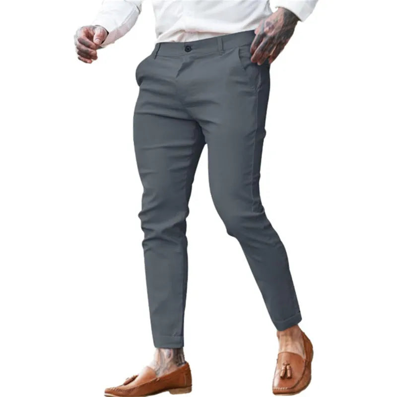 Men's slim fit pencil pants in cotton stretch fabric showing mid waist design and zipper fly closure