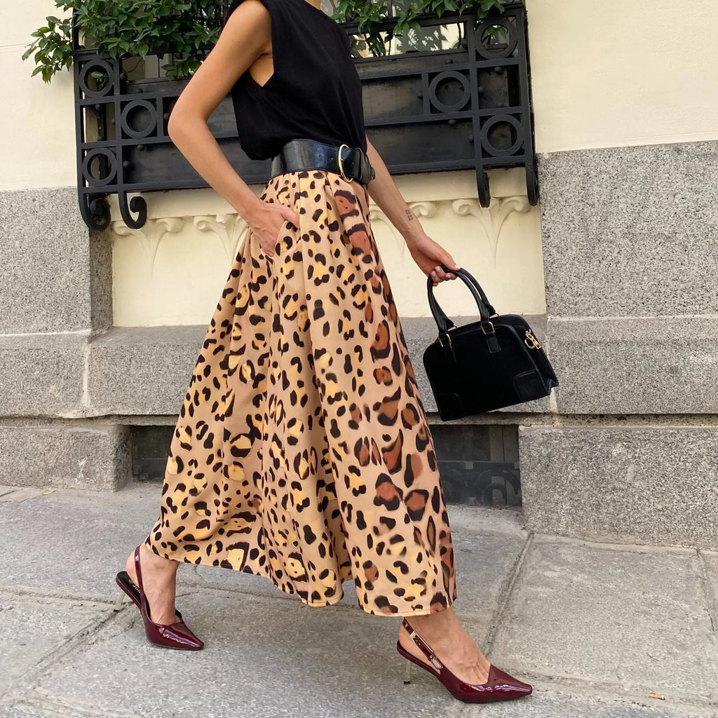 Brown leopard print women's A-line long skirt with a big hem, laid flat.