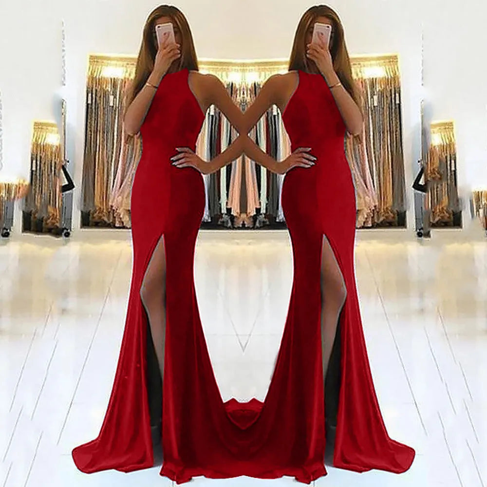 Red long evening dress with a high waist, hollow details, and a flowing large swing skirt.