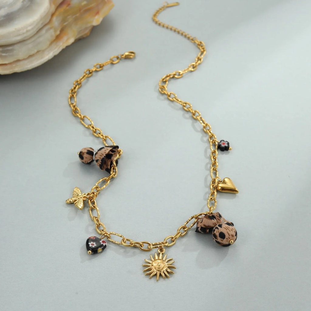 Women's stainless steel necklace with leopard, love heart, and flowers pendant on a regular chain.