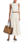White women's sleeveless top and long skirt suit set with retro embroidery on polyester fabric