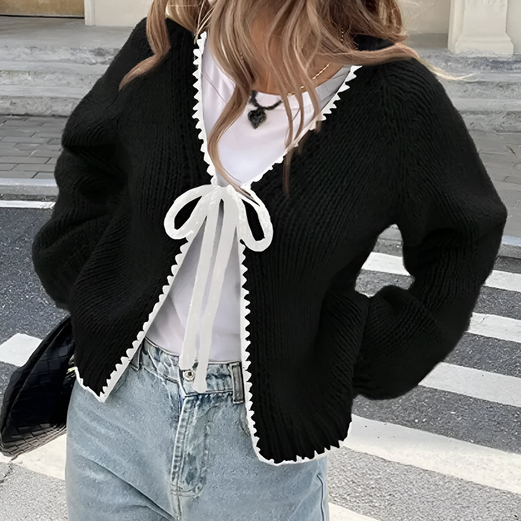 Grey loose-fit lace-up cardigan with long sleeves and a crochet flower detail on the front.