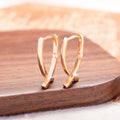 Copper cross earrings with rose gold finish for light luxury jewellery styling