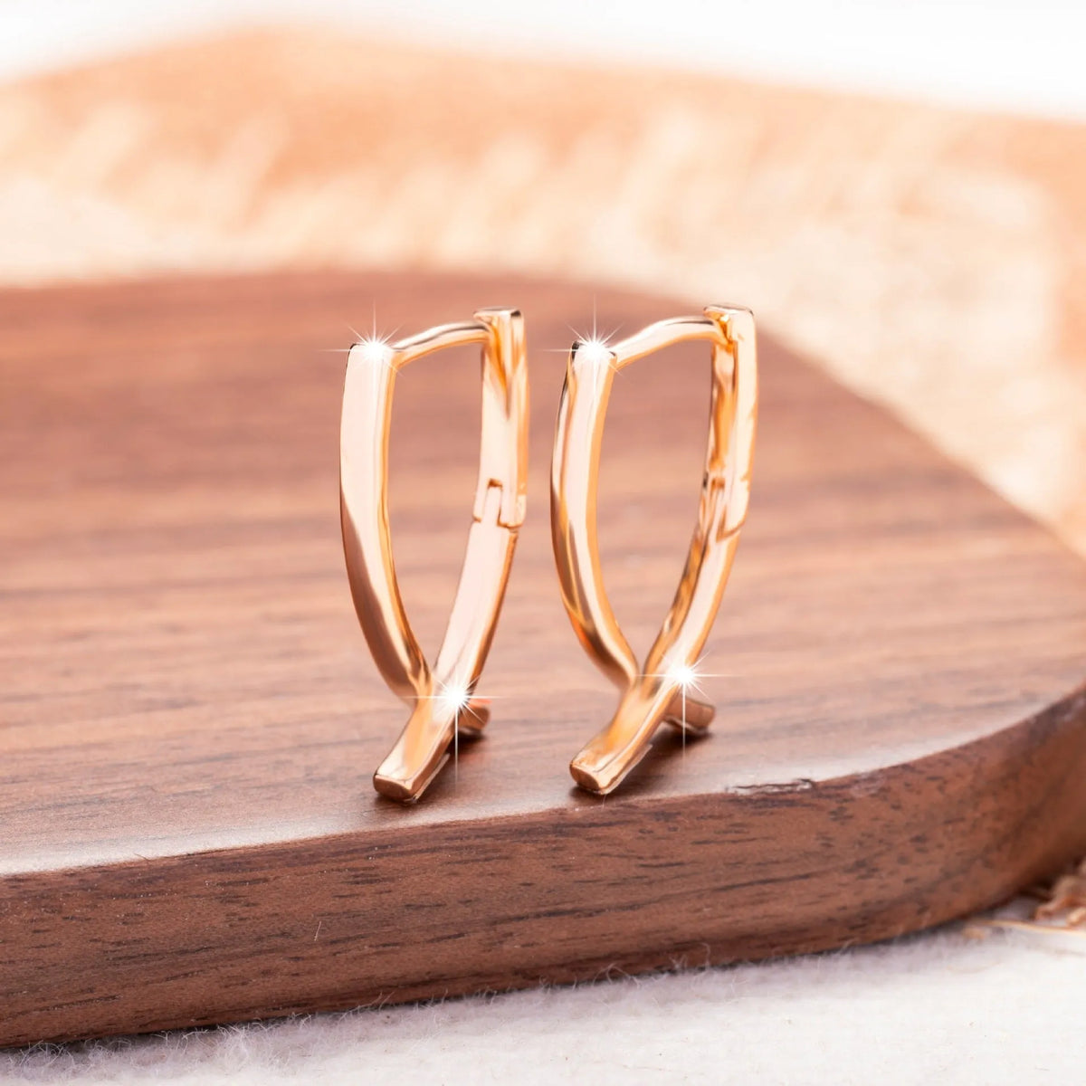 Copper cross earrings with rose gold finish for light luxury jewellery styling