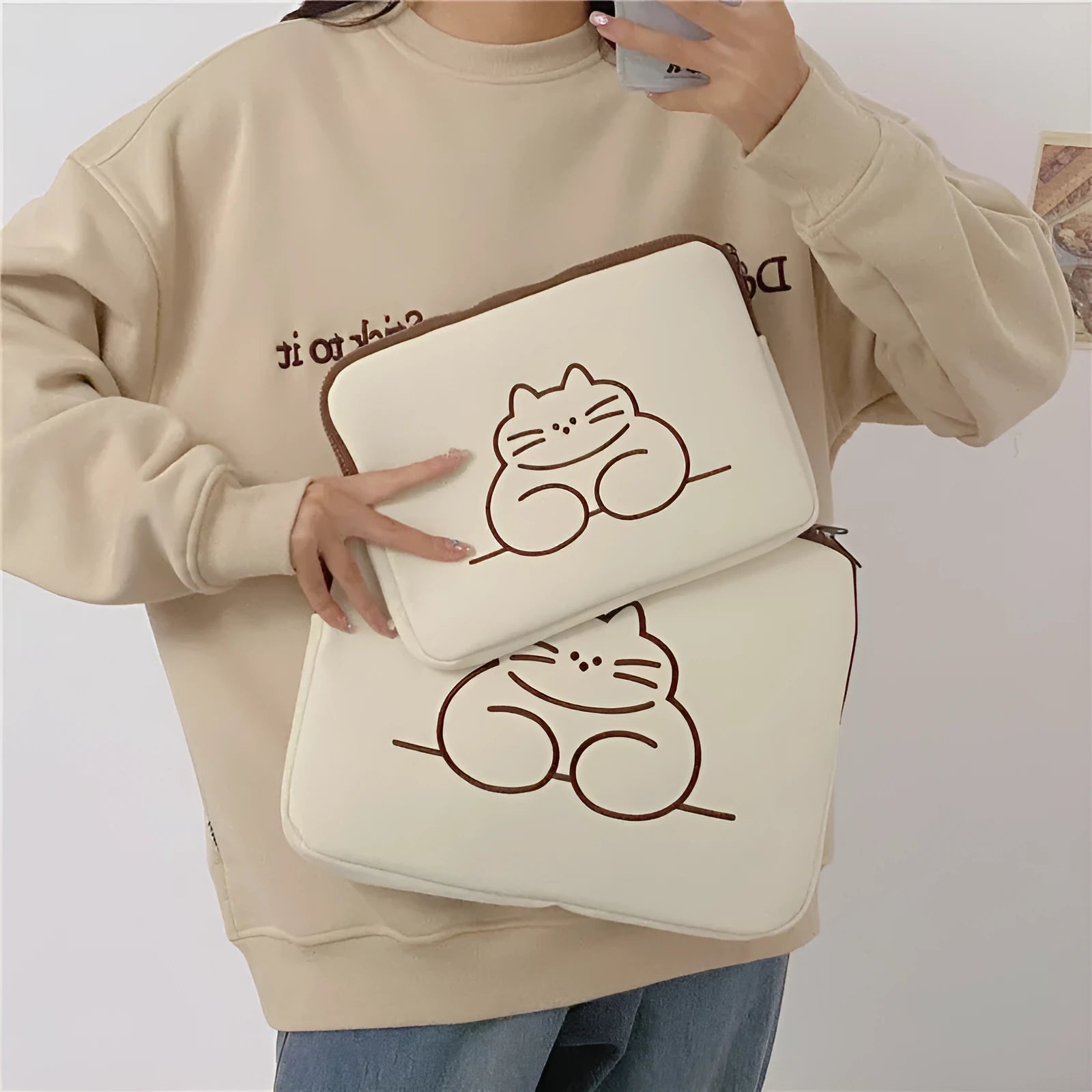 Animal embroidered tablet protective sleeve in nylon with zip opening showing size comparison