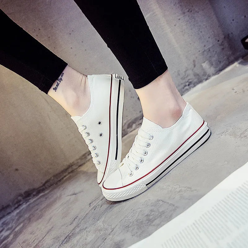 Women's solid colour canvas shoes in black, white and red colourways with casual design