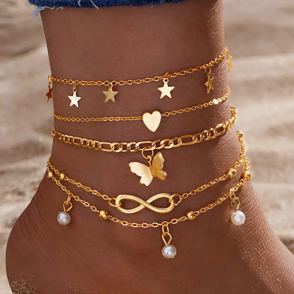 Butterfly pearl heart anklet set containing four alloy foot chain jewellery pieces for women