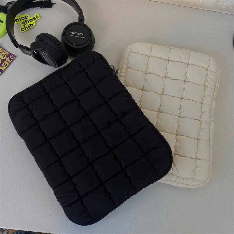 Large black nylon laptop bag open showing interior compartments for 15.6 inch computer