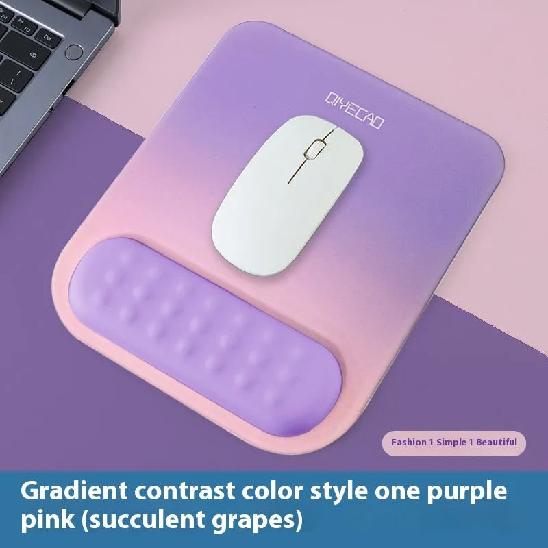 Ergonomic cloth-silicone mouse pad with raised wrist support on a desk