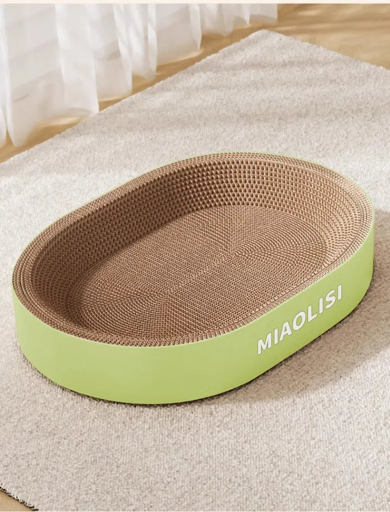 Oval shaped cat scratch board made of corrugated paper in green or purple, 55cm diameter