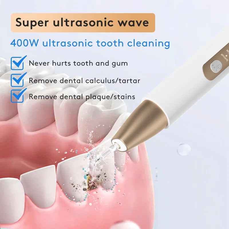 Gold-coloured handheld ultrasonic tooth cleaning device for tartar and stain removal