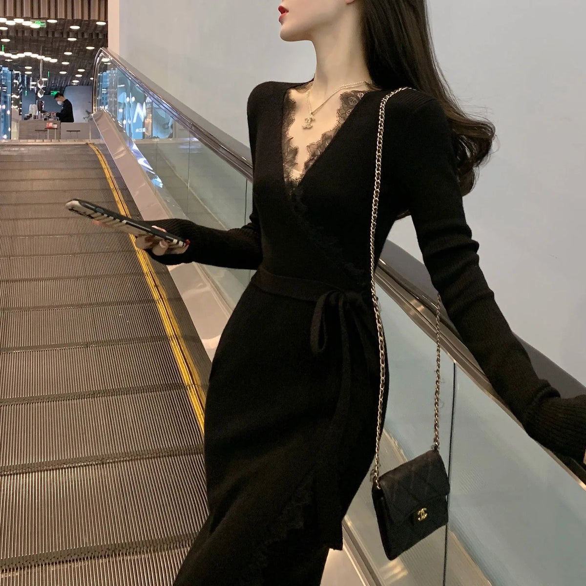 Black women's slim fit A-line woolen skirt, polyester princess dress on hanger.
