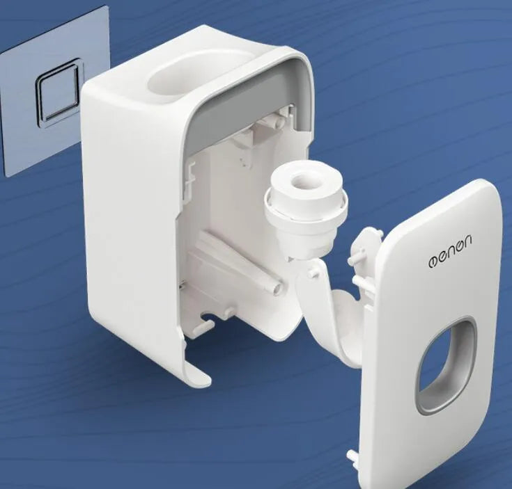 A blue automatic toothpaste dispenser mounted on a bathroom wall with a soft-touch button.