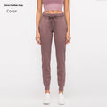 Women's high waist yoga pants with drawstring in navy blue, laid flat to show fit and fabric detail.