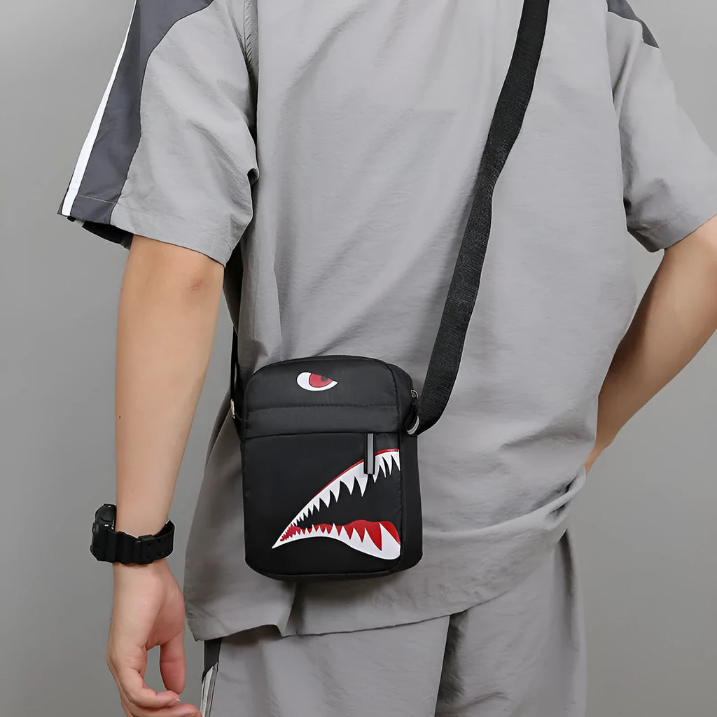 Men's small black Oxford cloth crossbody bag with an animal print pattern.