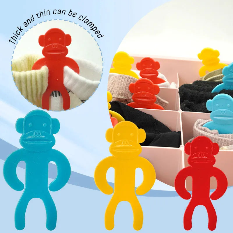 Plastic socks storage clips in blue, red and yellow colours for laundry organisation