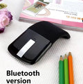 Black foldable Bluetooth touch wireless mouse shown open and closed next to a laptop