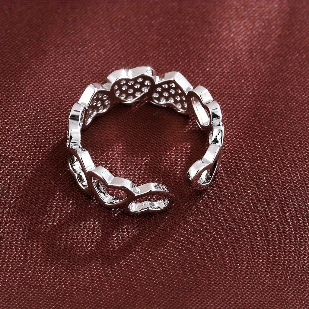 Adjustable opening couples ring with love heart design in gold or silver colour on geometric copper band