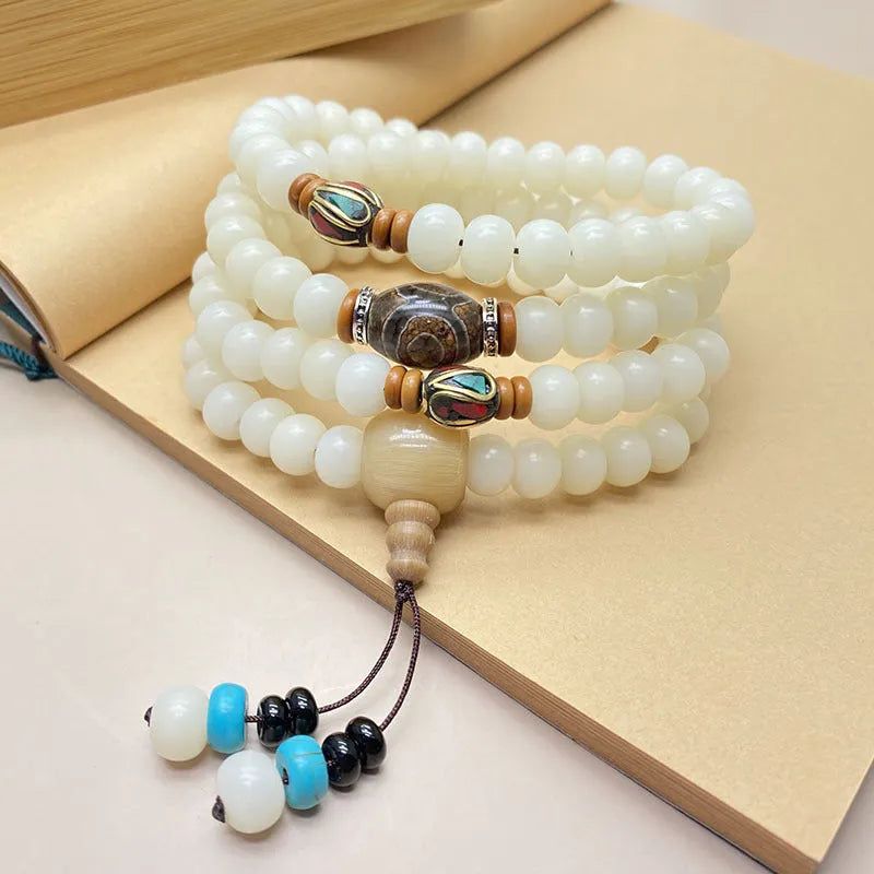 White jade bodhi bead bracelet with 108 beads in a mala style, shown in three different pattern options.