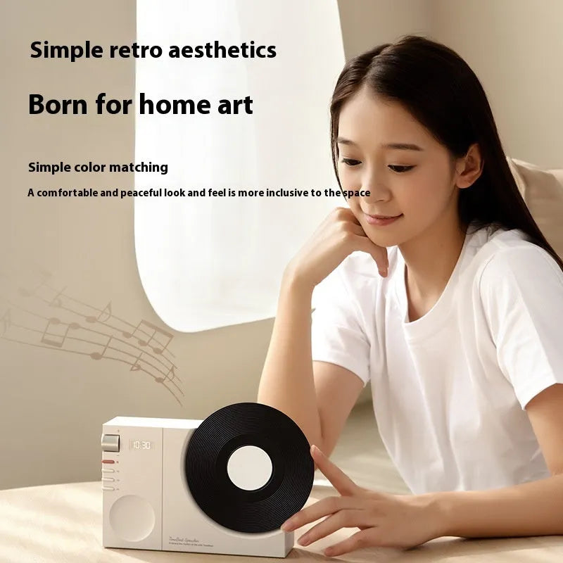 Mini Bluetooth speaker in Obsidian Black, Ivory White, Coral Pink, or Plum Green colours with USB charging port