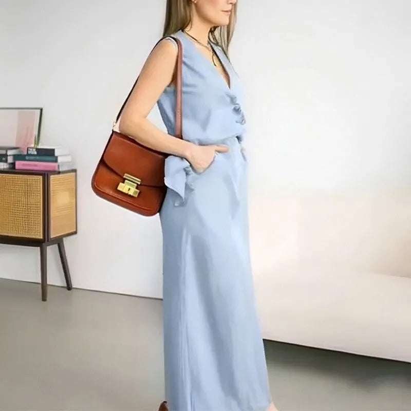 A woman's casual two-piece suit with a sleeveless loose vest and a long matching skirt.