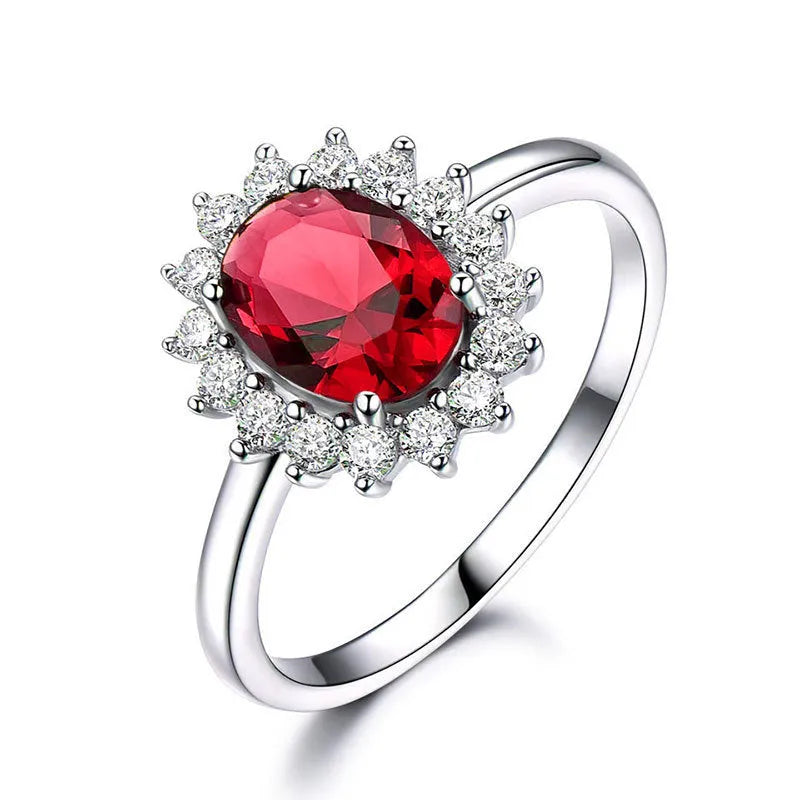 Copper flower-shaped ring with inlaid zirconia available in sapphire blue, green, and pomegranate red colours.
