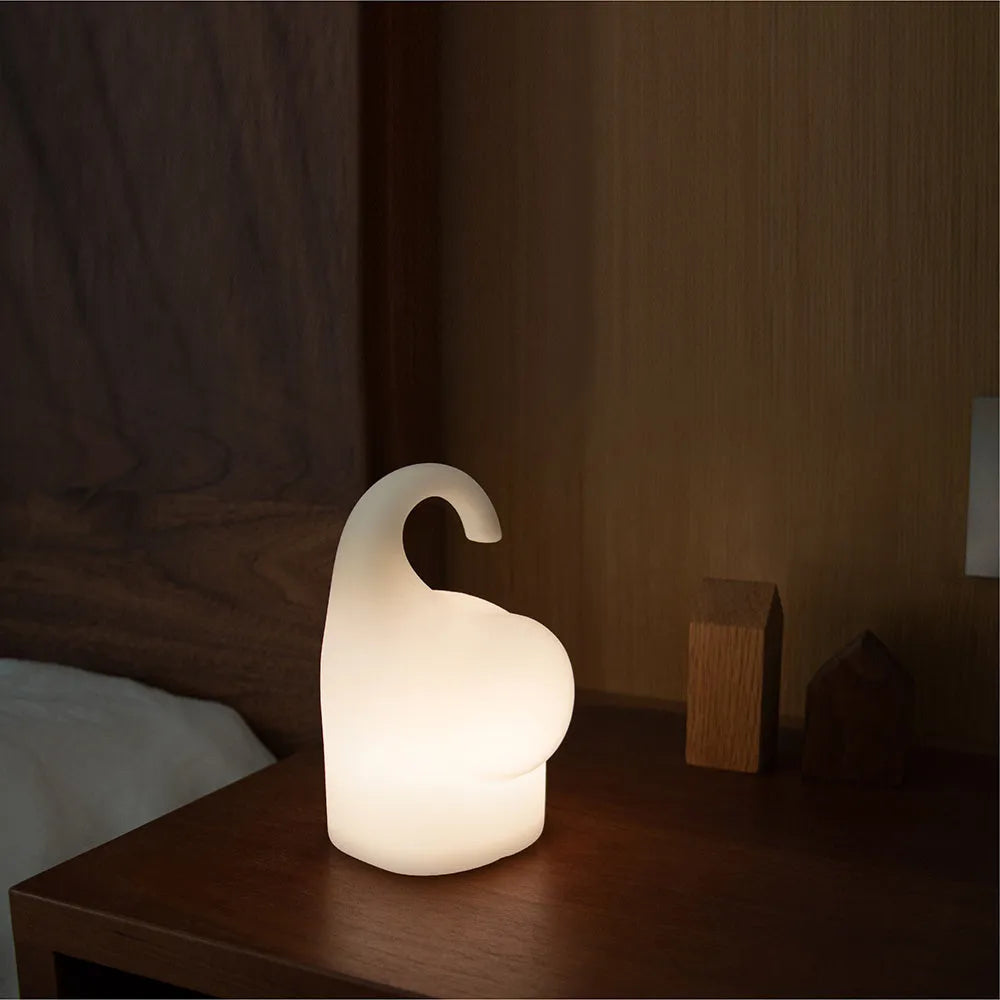 Elephant-shaped silicone night light with warm LED illumination for bedroom bedside use