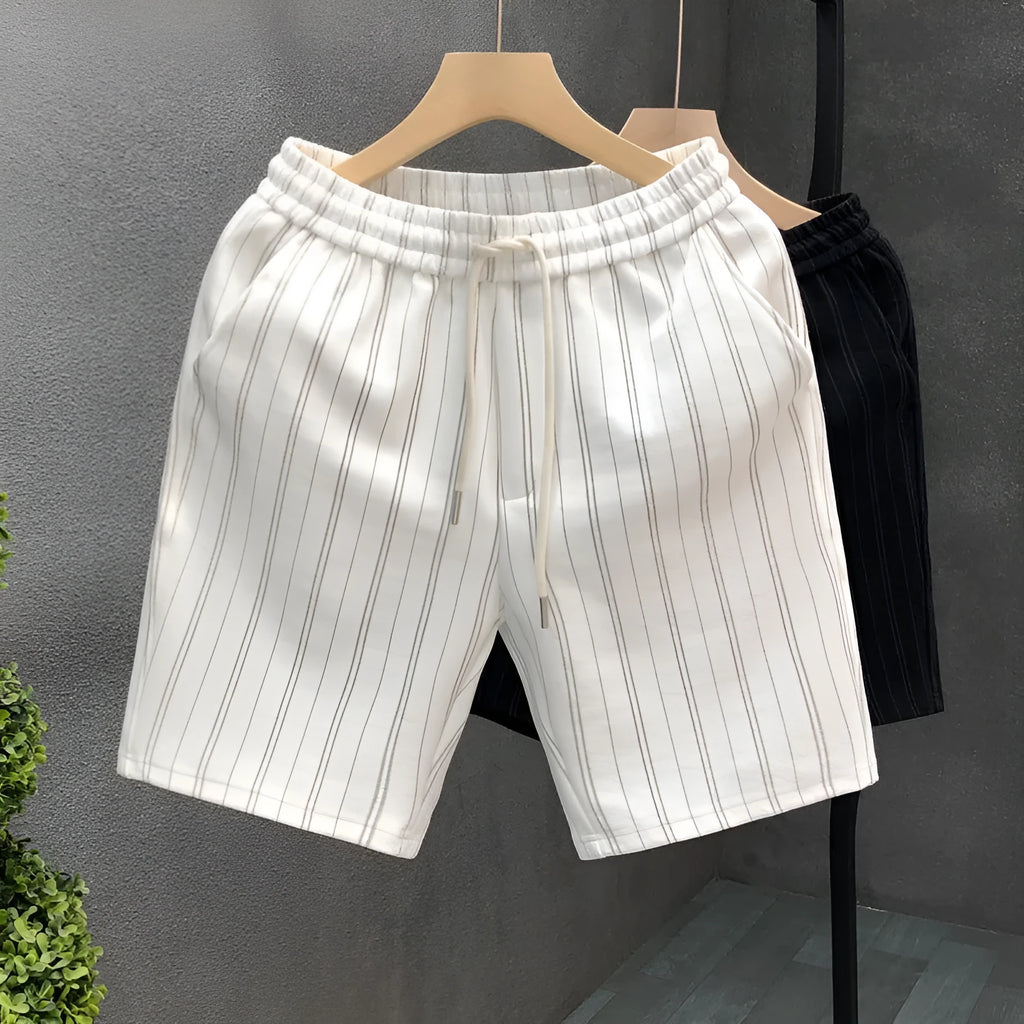 Men's black and white striped fleece-lined casual shorts with an ankle band and double waistband.