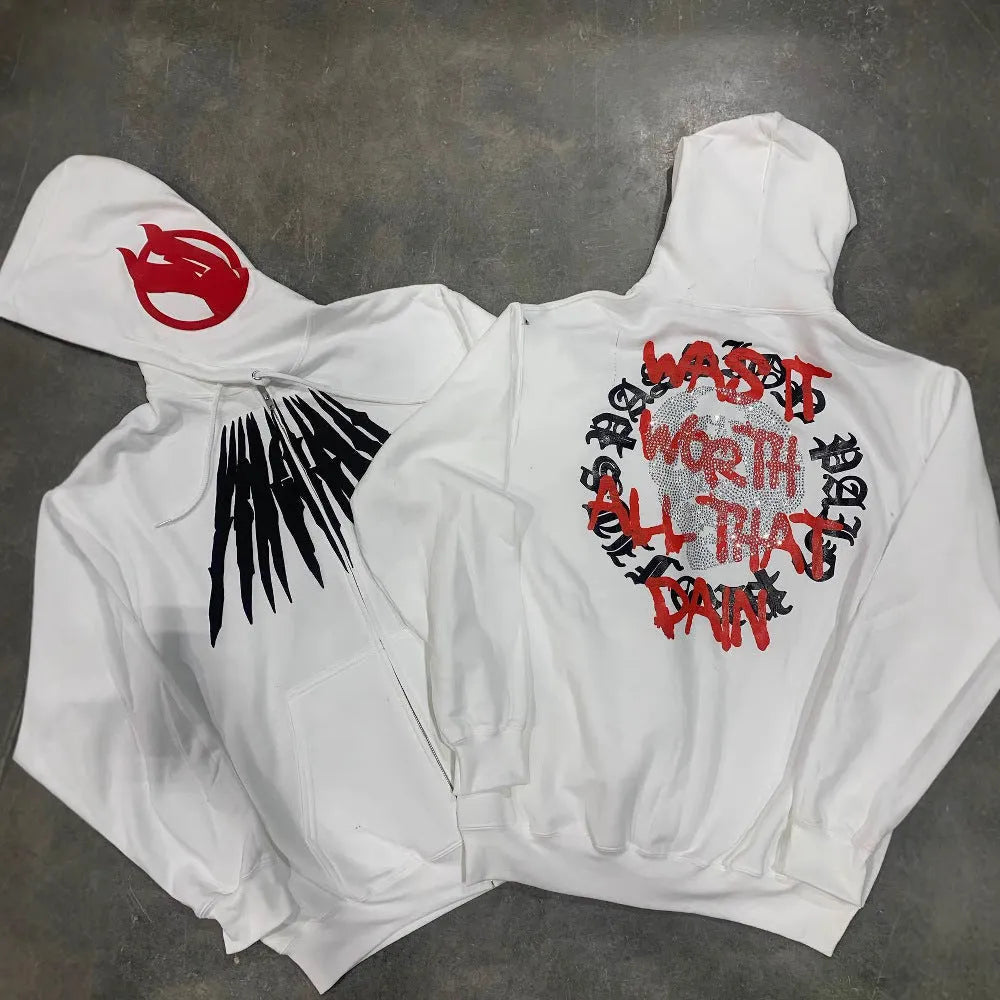 Black loose hooded sweatshirt with a white printed skull and letter design on the front.