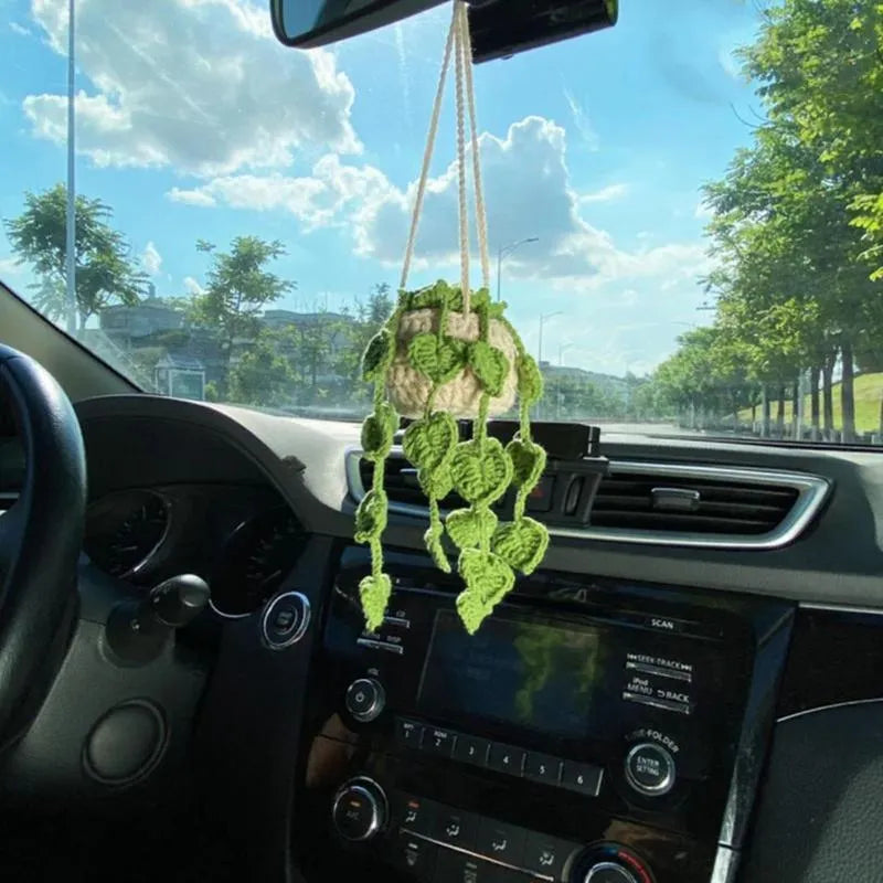 Green and white knitted wool car plant decoration with plastic base and hanging rope