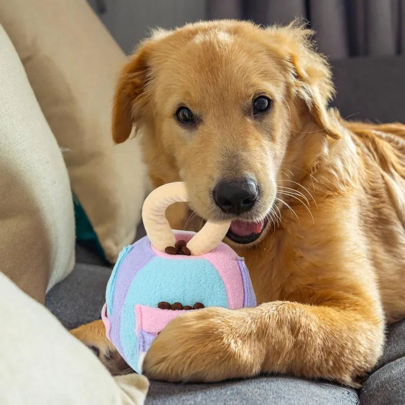 Green and pink dog plush ball squeaky toy with treat pockets for small to medium dogs.