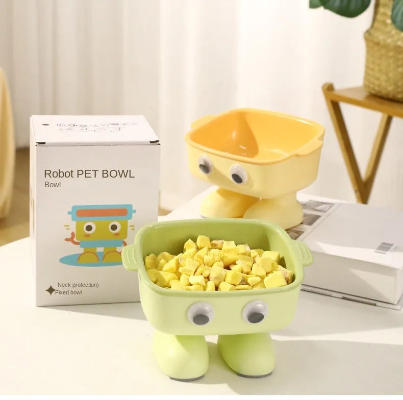 Green robot-shaped elevated cat bowl with tilted design and non-slip base