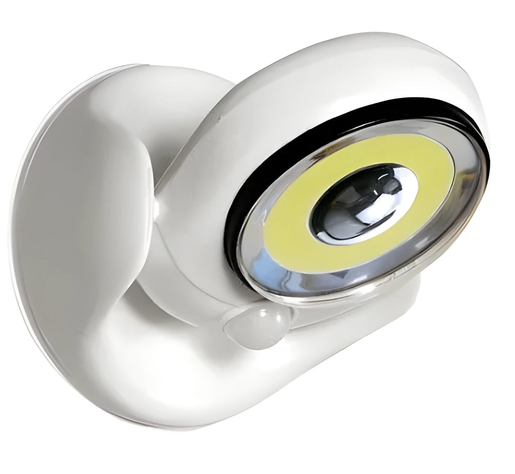 White Atomic Angel induction LED night light with touch sensor on front.