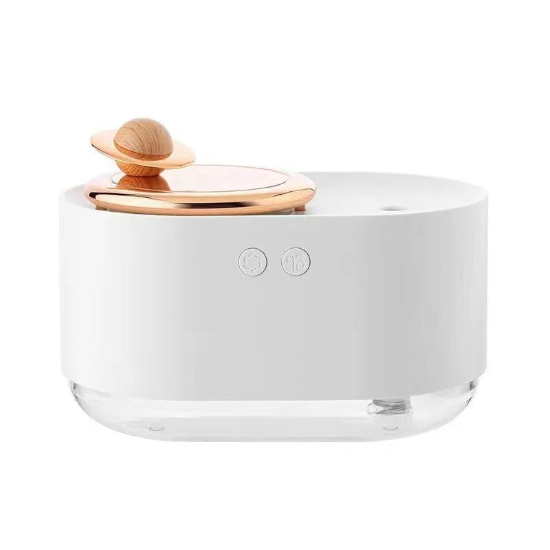 Green rotating planet USB humidifier with night light on wooden desk