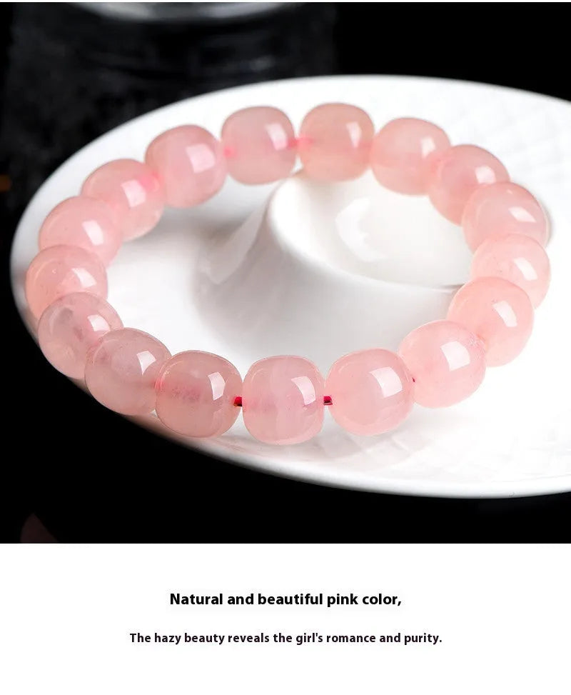 Natural pink crystal bracelet with barrel-shaped geometry beads measuring 8 x 10mm