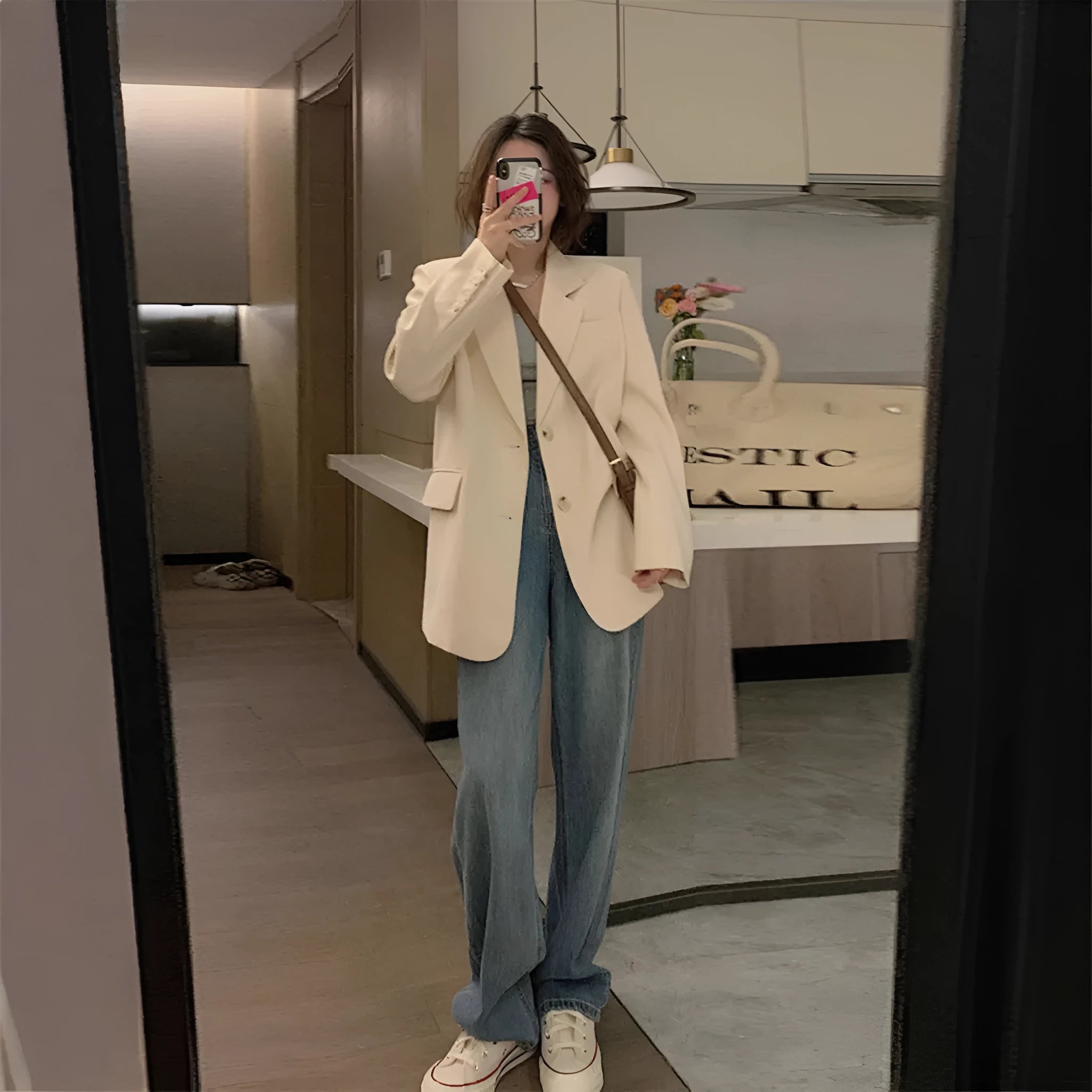 Women's Korean style solid color polyester suit jacket with regular long sleeves and pockets in black, beige, or coffee.