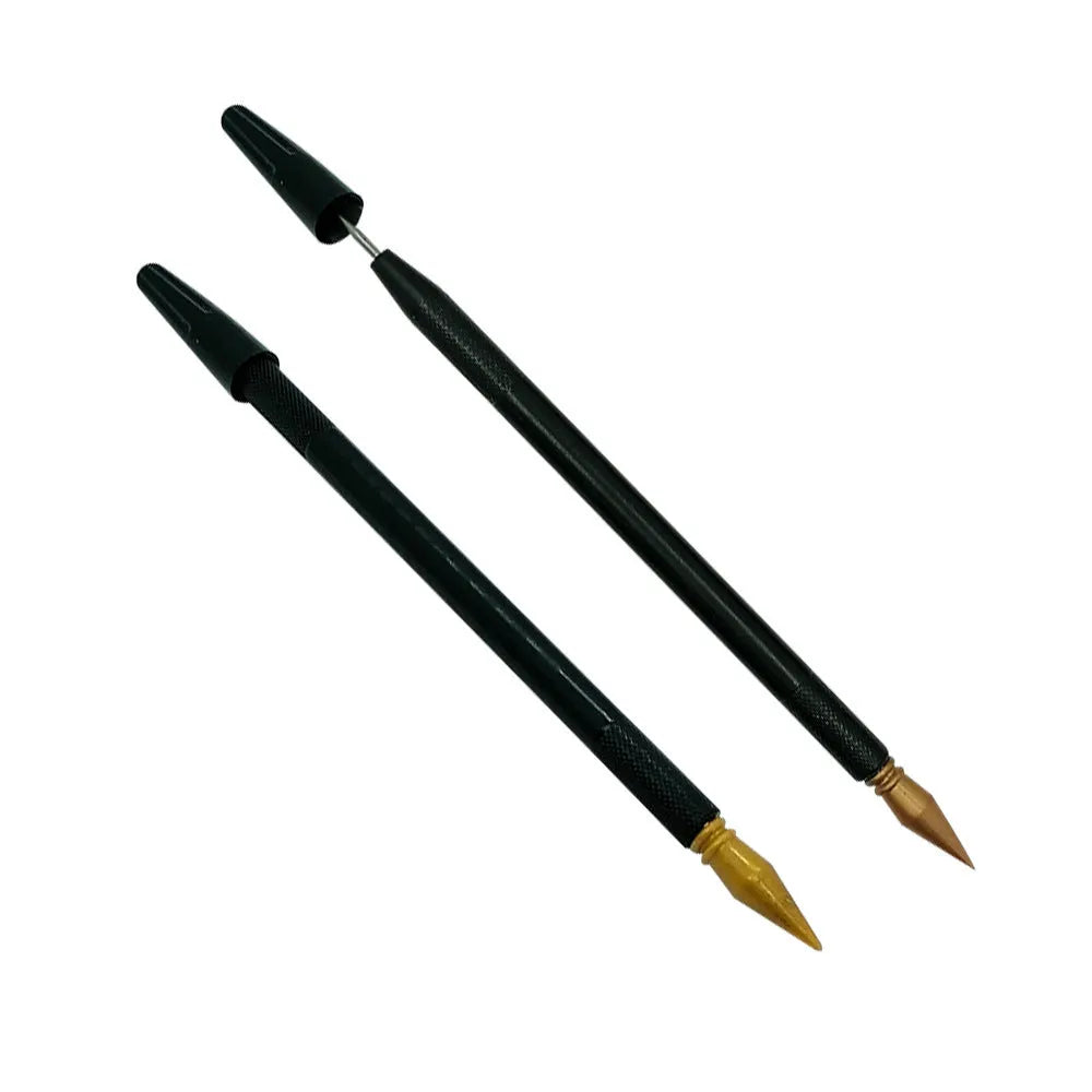 A white scratch pen tool for children's rainbow art and craft projects on a black surface.