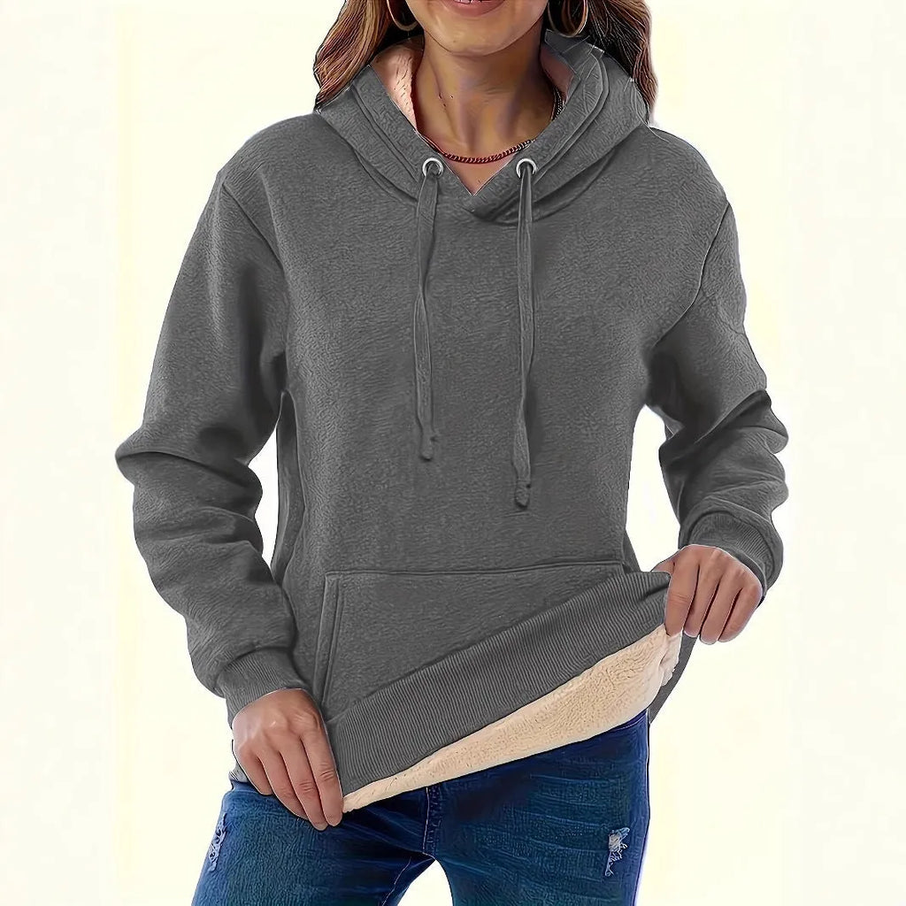 Women's thick polyester hooded sweater with pockets in loose fit