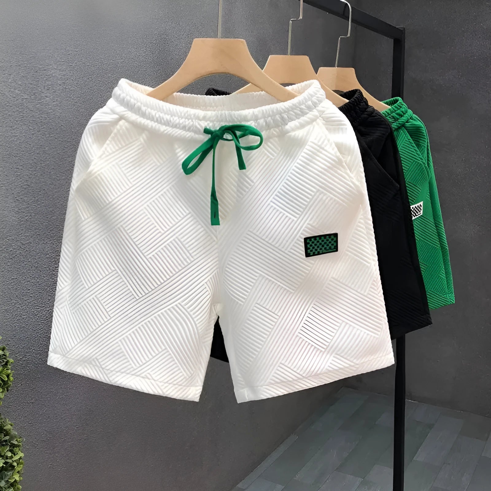 Micro-elastic polyester sports shorts in white, black and green colours for beach and casual wear