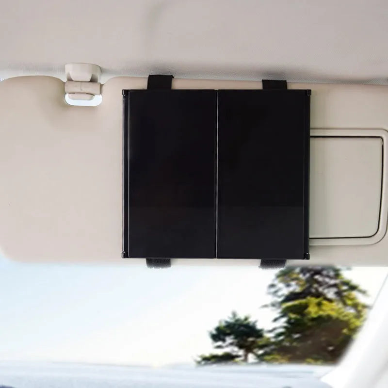 Silver car folding makeup mirror shown open and closed on a car visor