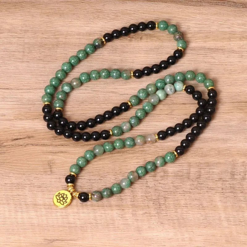 Green and black alloy elastic beaded long bracelet showing stretch design and personality-themed elements