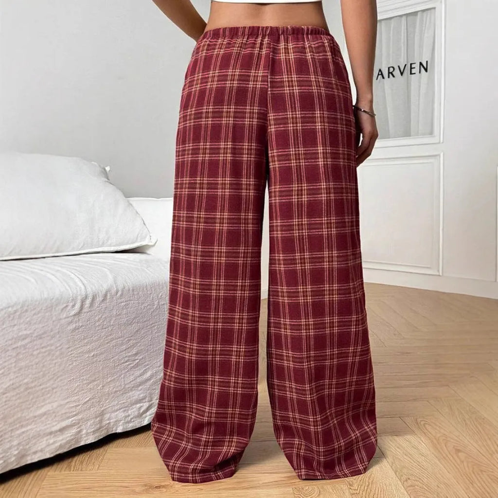 Women's loose drawstring trousers with plaid pattern and side pockets in blue or red colours