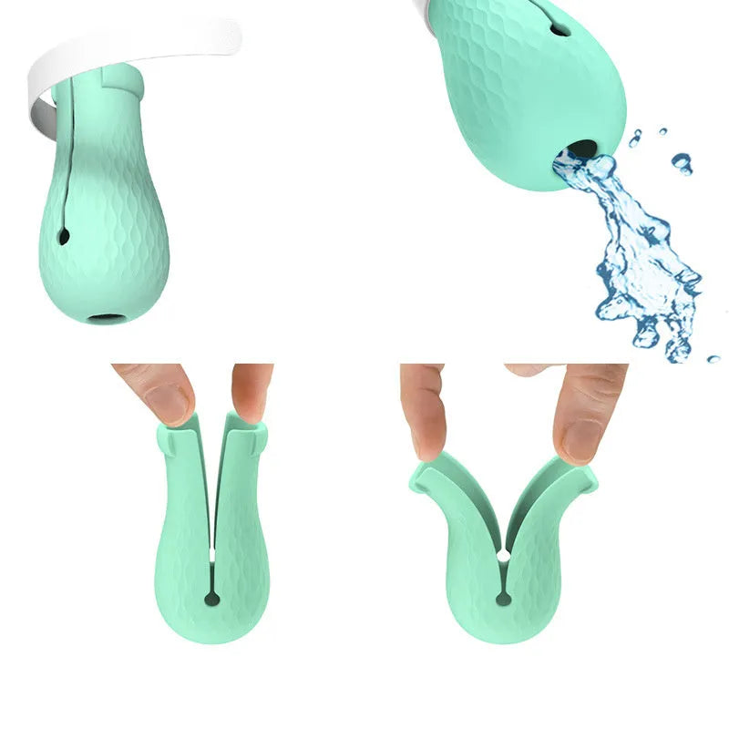 Set of four green silicone cat paw covers used for anti-scratch protection during washing and medicine