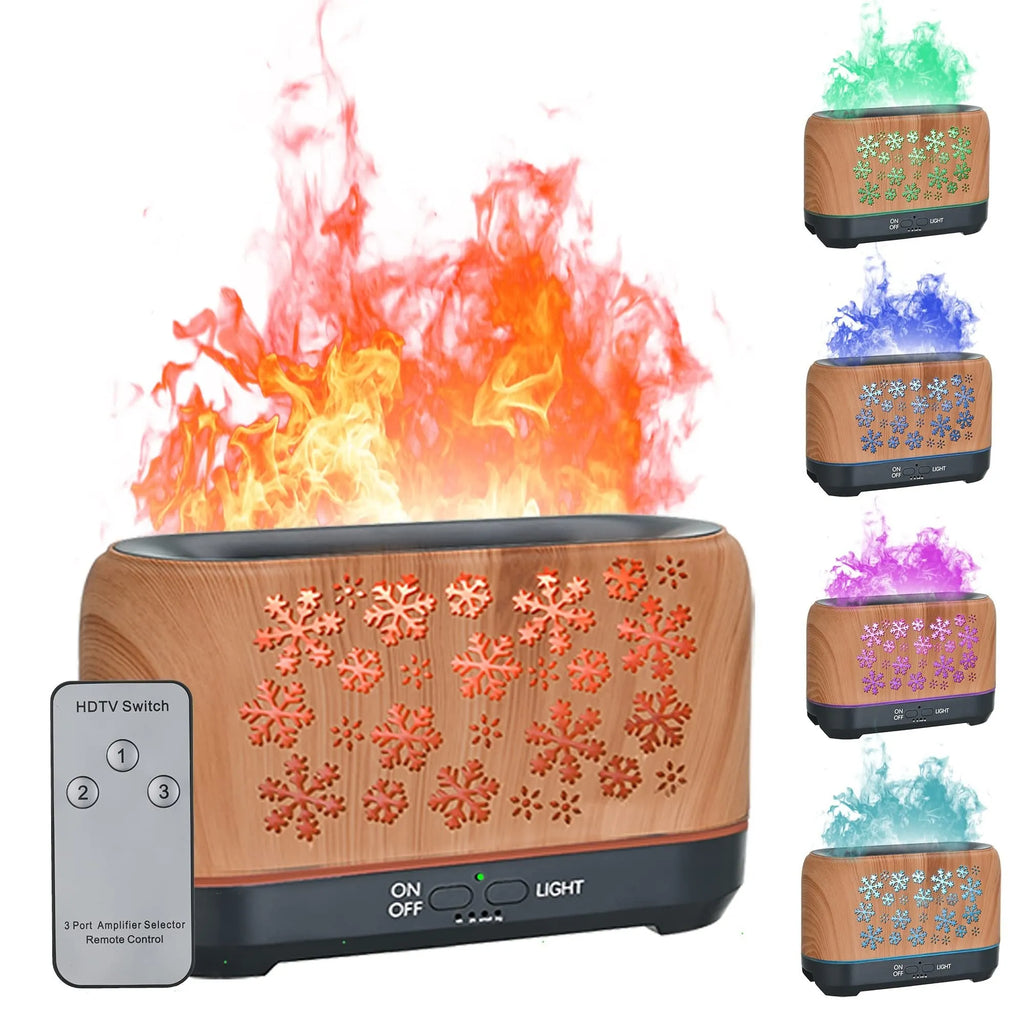 Square snowflake wood grain aromatherapy diffuser showing colourful flame effect mist and remote control on a desktop.