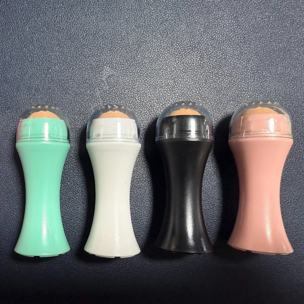 Portable volcanic stone facial roller for oily skin control in black, green, pink, or white