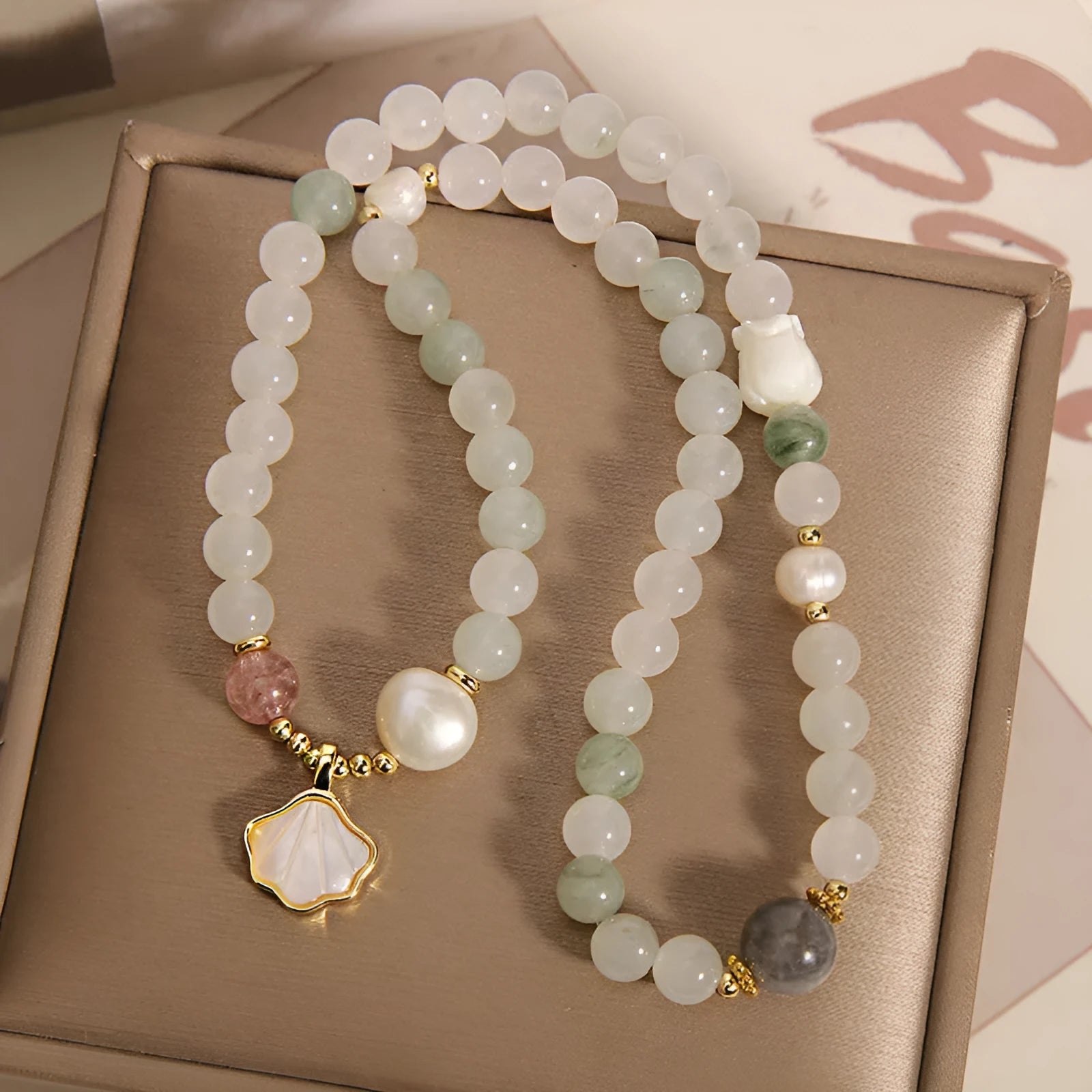 Gold-plated crystal bracelet for women with a Tianshan jade green ginkgo leaf pendant and rhinestones.