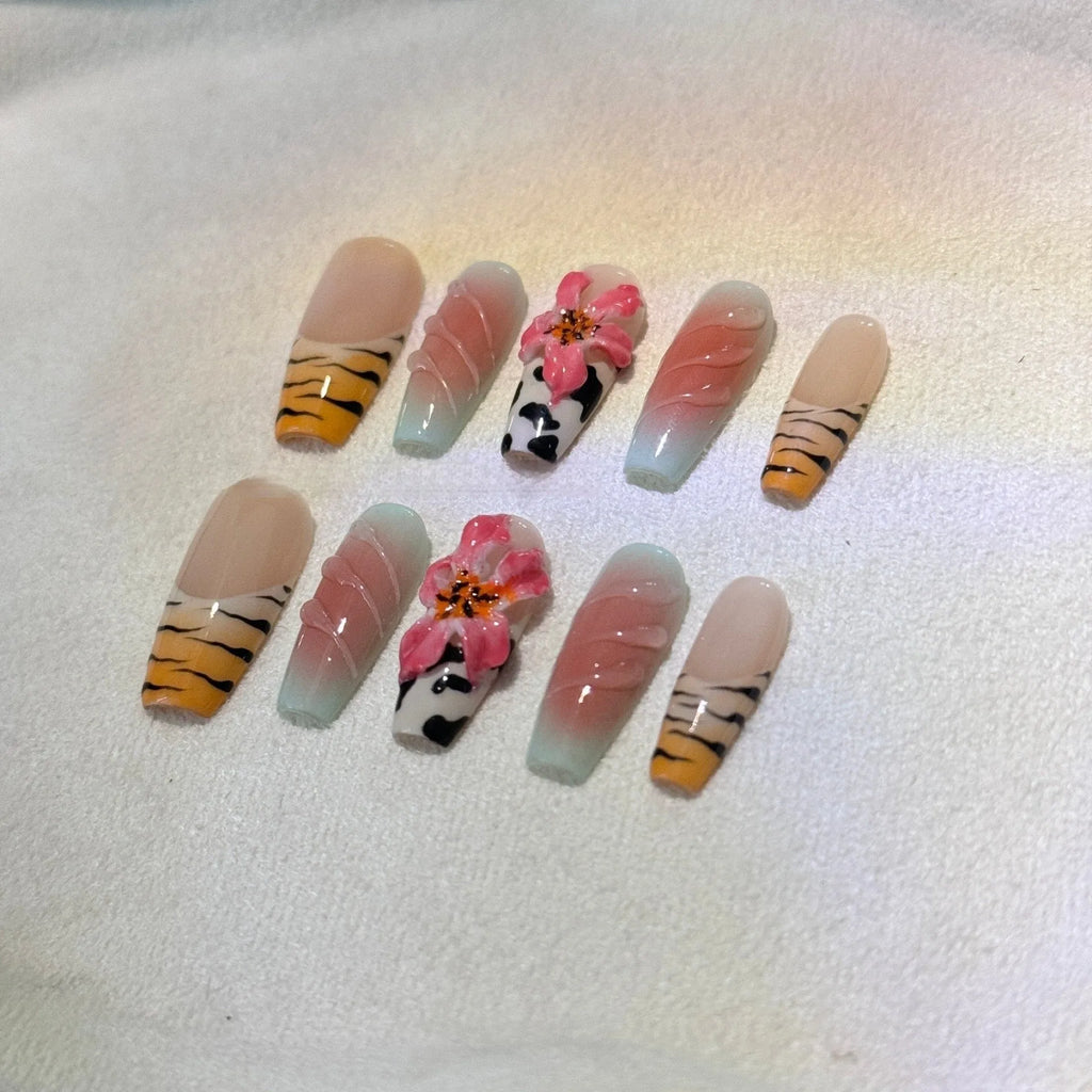 Zebra pattern Lily hand carving nail art with embossed flower designs in four sizes