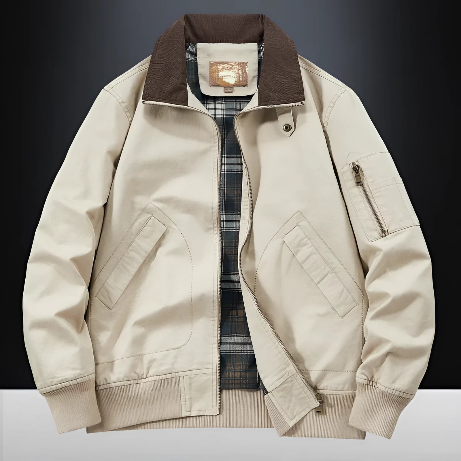 Men's camel coloured washed cotton baseball flight jacket on a hanger