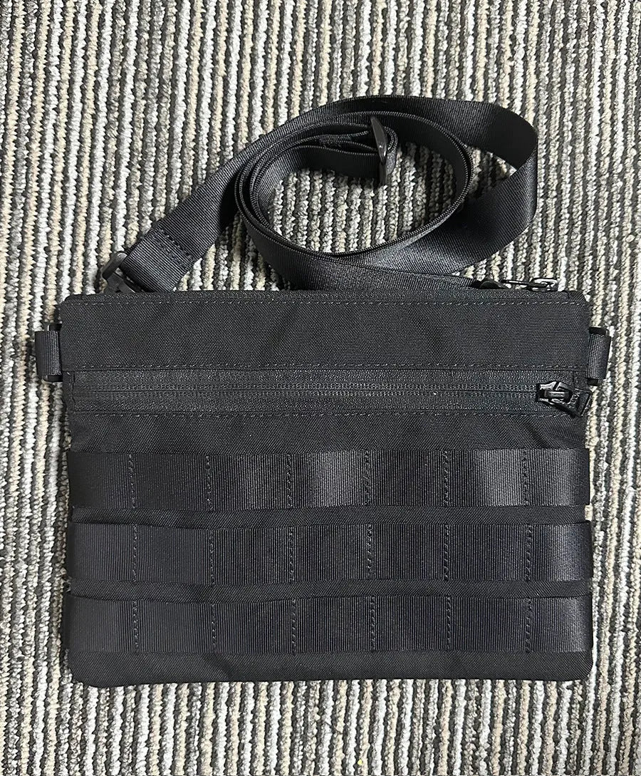 Black Oxford cloth portable outdoor organiser kit measuring 18cm by 3.5cm